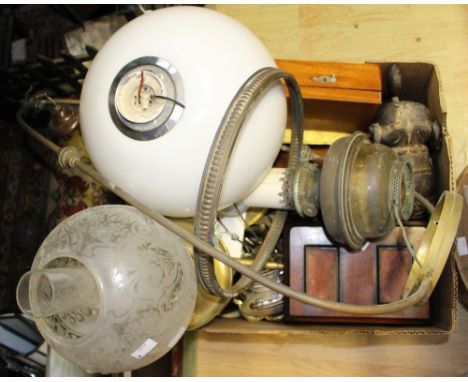 A brass oil lamp, a hanging oil lamp converted to electricity, a pendant ceiling light, a desk tidy, smoking items plus coppe