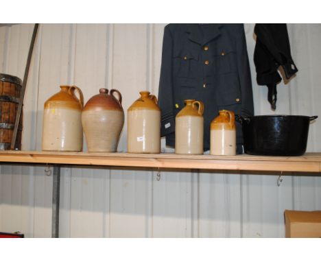 Five various sized stoneware flagons and an enamel boiling pan 