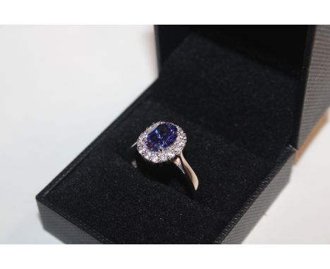 A Sterling silver Nilamani & Cubic Zirconia halo ring, ring size T/U