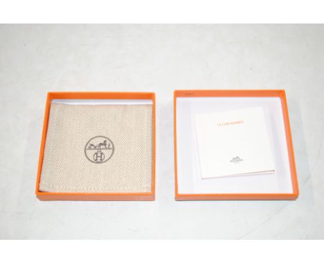 A Hermes of Paris jewellery box with cloth bag and hook