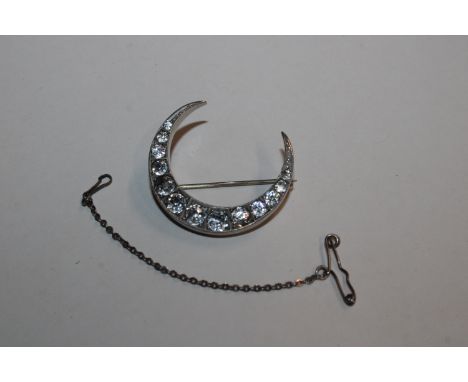 An 1889 George Loveridge Sterling silver paster set crescent brooch, 6.2gms 