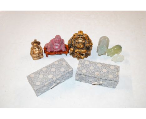 Two boxes Oriental stone seals, jade coloured pig ornaments, Buddha figures