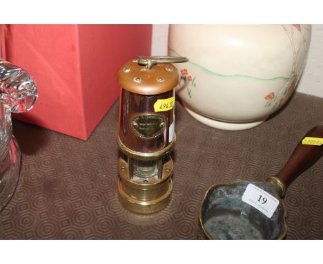 A copper and brass lamp &amp; limelight company miners lamp
