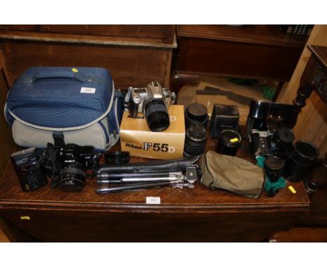 A quantity of various cameras, lenses, tripod, carrying bags etc.