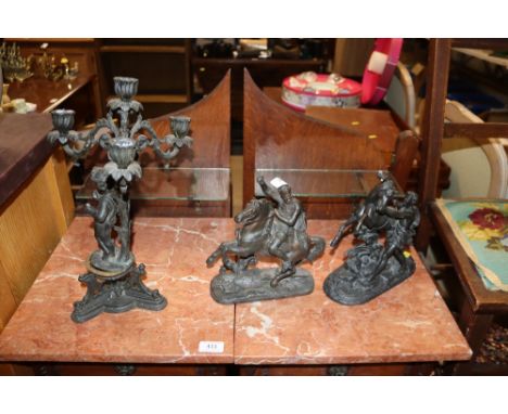 A spelter Marley horse and groom figure, another of St George and a cherub decorated candelabra 