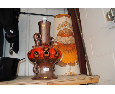 A retro pottery table lamp, complete with printed floral shade 