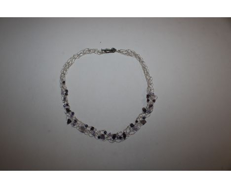 A Sterling silver wire modernist necklace with amethyst, pearls and moonstone 