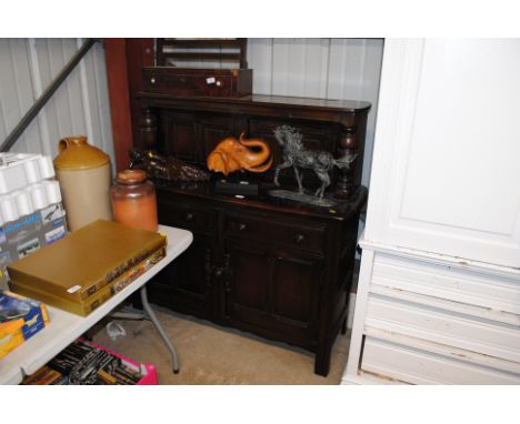 An Ercol court cupboard