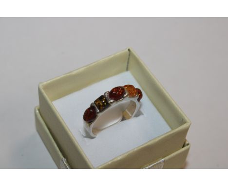 An Art Nouveau style Sterling silver and amber ring, ring size T