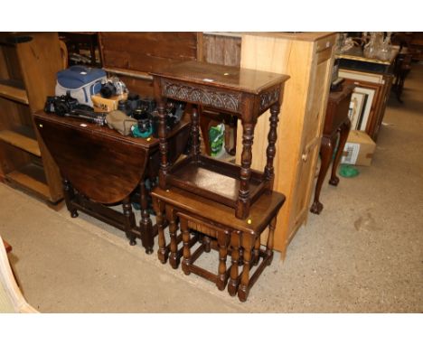 A carved oak joint stool and a nest of three Ercol type coffee tables 