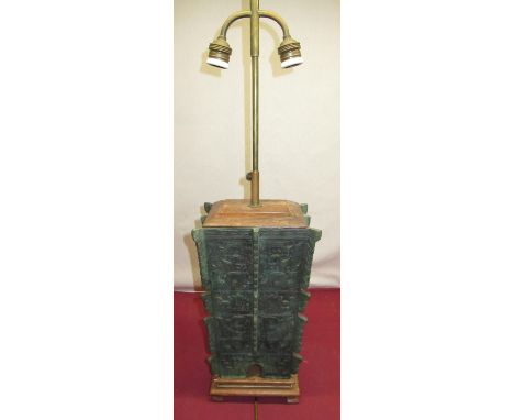 Large Chinese Archaic style verdigree cast metal table lamp with two downcurved branches on stepped wooden base with bracket 