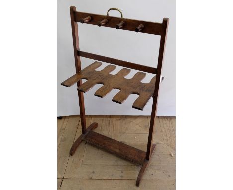 Early C20th Country House mahogany boot and whip rack, with eight pegs, brass carry handle on outsplayed supports, W54cm D35c