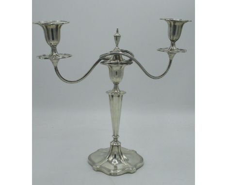 Geo.V hallmarked Sterling silver Regency style two light candelabra, twin scroll branches with urn sconces, weighted base by 