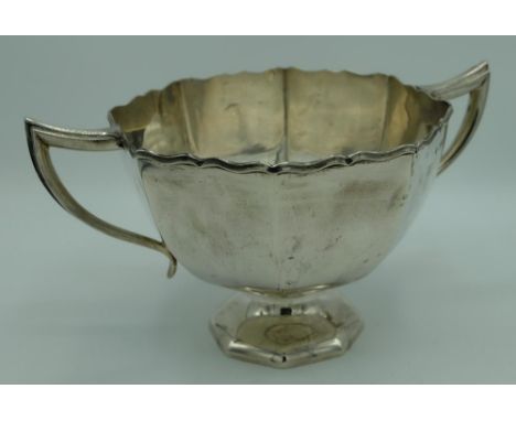 Edw.VII hallmarked silver two handled pedestal bowl, tapering octagonal body with waved edge and engraved with crest, by Henr