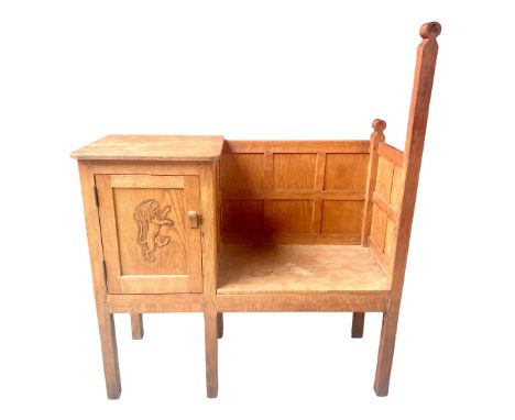 Yorkshire Oak - Telephone seat of panelled construction with adzed top and lion carved panel door on six square supports, W10