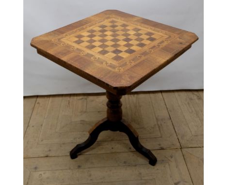 Late C19th walnut and satinwood Sorrento tripod games table, square chessboard top with canted corners on turned column and t