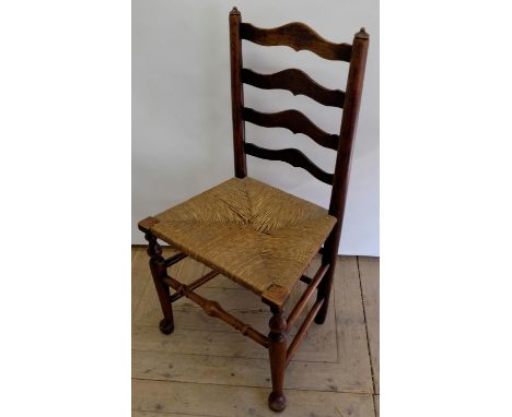 C19th Country made ash and elm ladder back  dining chair, with rush seats on turned supports with pad feet joined by stretche