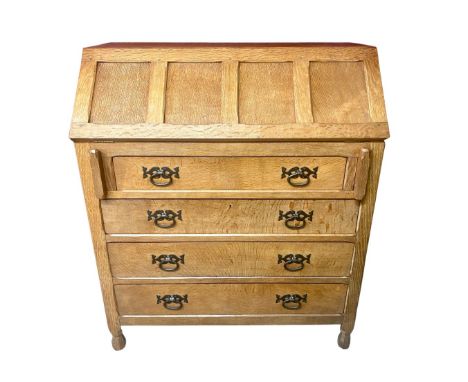 Sid Pollard of Thirsk - Oak bureau, adzed four panel front, above four long drawers with cast iron handles on faceted baluste