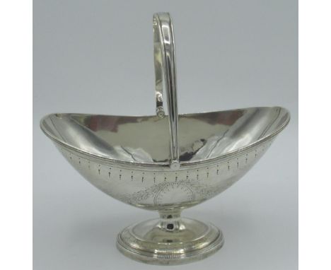 Victorian hallmarked Sterling silver navette bonbon dish with swing handle on circular pedestal base, bright cut and monogram