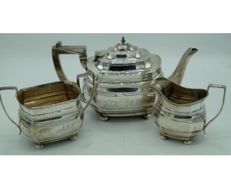 Geo.V hallmarked Sterling silver three piece tea service, stepped shaped rectangular bodies with similar handles engraved wit