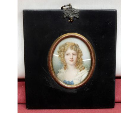 English School (C19th): Miniature head and shoulder portrait of a young lady, in lace trimmed dress, her hair in ringlettes, 