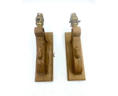 Robert Mouseman Thompson - Pair of adzed oak wall lights with scroll carved detail and signature mouse, on rectangular backpl