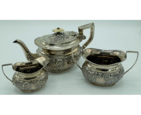 Edw.VII hallmarked silver three-piece Batchelors tea service, ovoid bodies repoussé with scrolls, by William Adams Ltd, Birmi