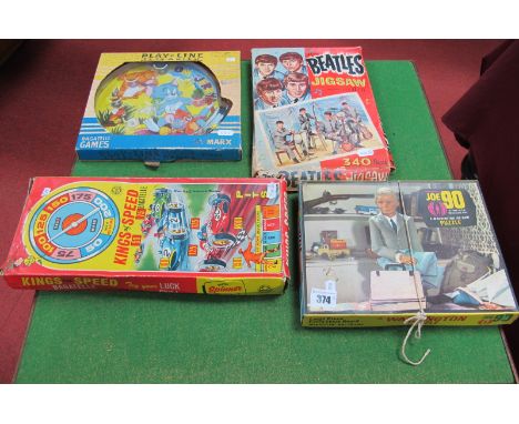 A Joe 90 Jigsaw, a Beatles Jigsaw, a Marx Tom and Jerry Bagatelle and a Marx 'Kings of Speed' Bagatelle, all unchecked, boxed