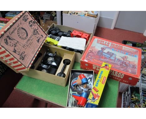 A Walkie Talkie 'Space Patrol, by Merit, a Toy Telephone Set by Chad Valley and a 'Wells Fargo Train' Set by Marx, all boxed.