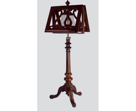 A mid 19th century rosewood pedestal duet stand, the double sided lyre pierced sheet music rests on a telescopic gilt metal c
