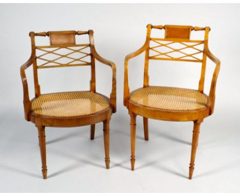 Two early 20th century birchwood open armchairs each with a turned top rail with tablet centre, over a latticed, pierced hori