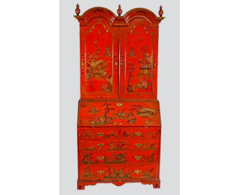 A 20th century scarlet lacquer, double dome bureau bookcase in the George I Chinese style, the double domed top over two sing