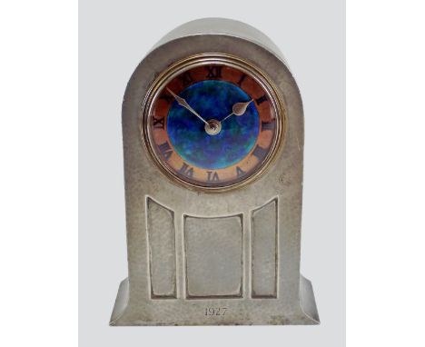 A Liberty & Co pewter mantle clock, model no. 01269, domed form with cast pilaster decoration, the circular 3 1/2 inch dial e