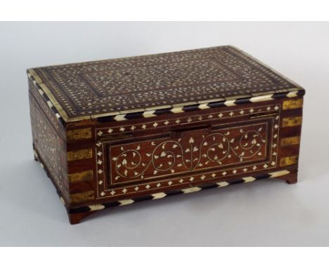 A 19th century Indian bone and ivory inlaid dressing box, later fitted to the interior, the box of campaign style with brass 