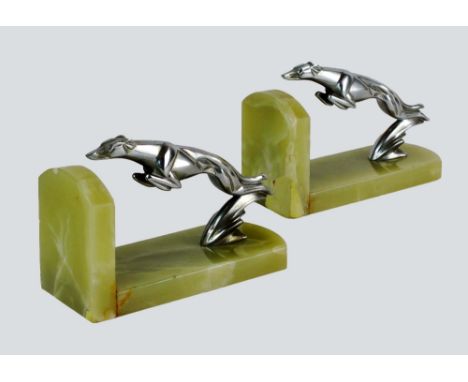 A pair of Art Deco bookends, the stylised leaping greyhound mounts after Casimir Brau's Delage mascot, the mascots numbered 7