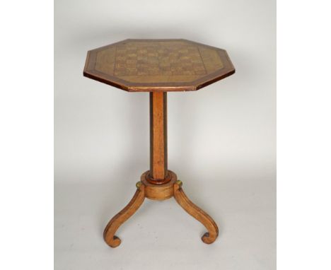 An early 19th century rosewood, ash and satinwood, brass inlaid and bound pedestal games table, in the manner of Le Gaigneur,