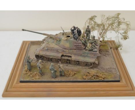 Highly detailed and very well constructed 1/35 scale plastic model WWII diorama depicting German Army King Tiger with crew an