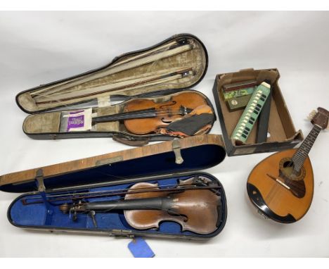 Collection of musical instruments, incl. two early 20th century violins, a Suzuki mandolin, harmonicas, etc.
