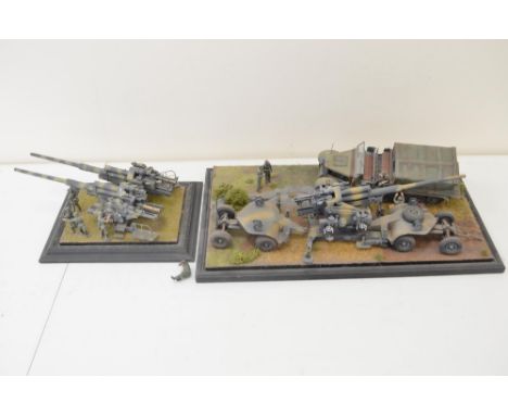 A pair of highly detailed and very well constructed 1/35 scale plastic model WWII dioramas depicting German Army artillery pi