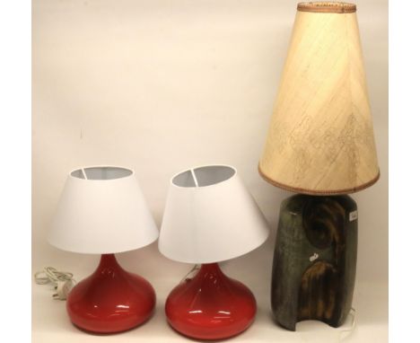 Pair of mid-century style lamps with red ceramic bases and white shades, and a lamp with ceramic 'log style' base and a shade