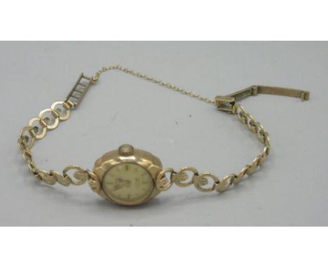 Rotary lady's 9ct gold wristwatch on integrated fancy link bracelet stamped .375, signed champagne dial with applied baton in