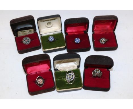 Seven Scottish hallmarked silver millefiori glass rings by Caithness Jewellery, each with a millefiori glass cabochon, variou