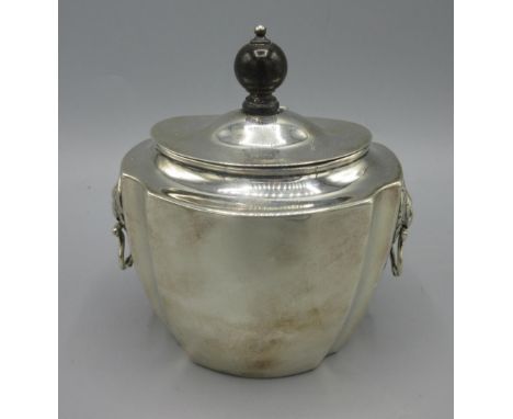 Late Victorian silver tea caddy, hinged lid with polished ebony finial, gilt interior, lion mask and ring handles by Brook &a