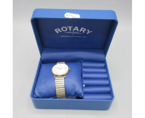 Rotary 18ct gold quartz dress wristwatch with date on gold plated expanding bracelet, signed white Roman dial, snap on case b