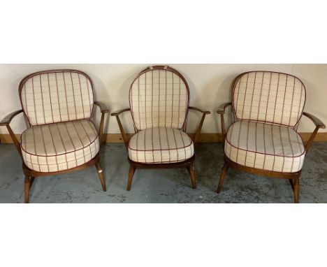 Pair of Ercol stick back arm chairs and a similar arched back arm chair, all with loose cushions (3)