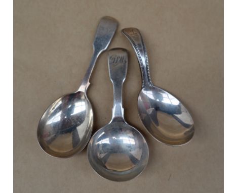 A Victorian silver fiddle pattern caddy spoon, with an oval shaped bowl, London, 1867, H J Lias & Son together with a Victori