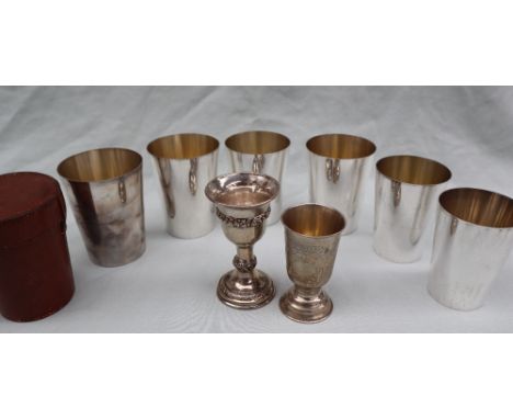 Asprey &amp; Co a set of six silver plated graduating beakers with gilt interior, contained in a leather case, sizes vary fro