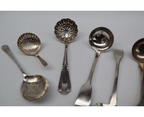 A set of three William IV Irish silver sauce ladles, Dublin, 1833, together with a silver sifting spoon, silver caddy spoon a