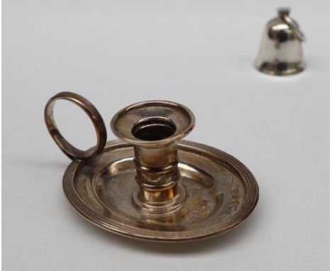 A George III silver taper stick with a ribbed column, ring handle and oval drip tray, London, 1824, Charles Rawlings, 3.5cm h