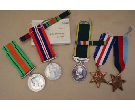A George VI Territorial medal issued to 1457372 CPL. J E Faulkner R. SIGS together with four World War II medals including Th